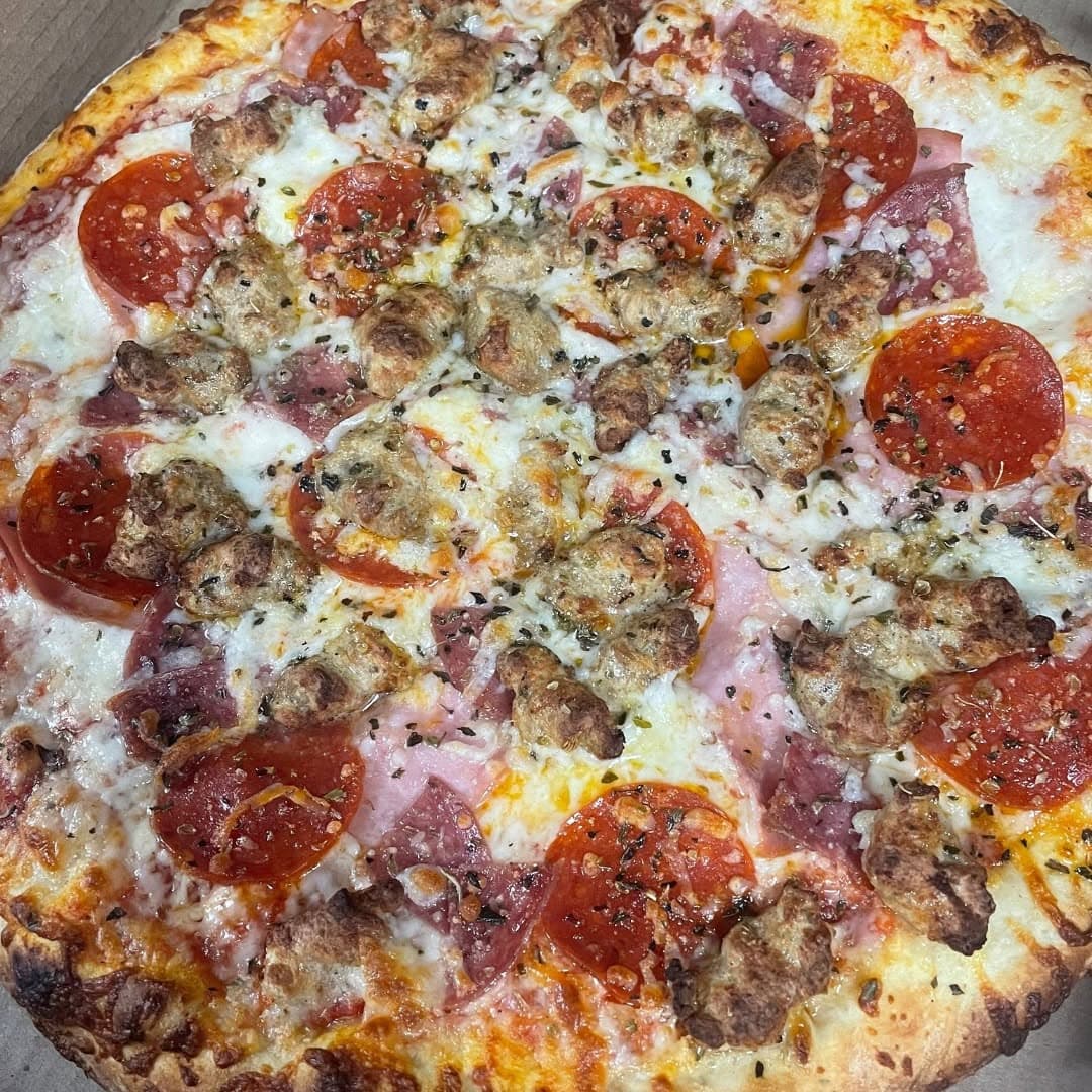 Loaded brick oven pizza fresh from Windsor Brick Oven Pizza & Subs