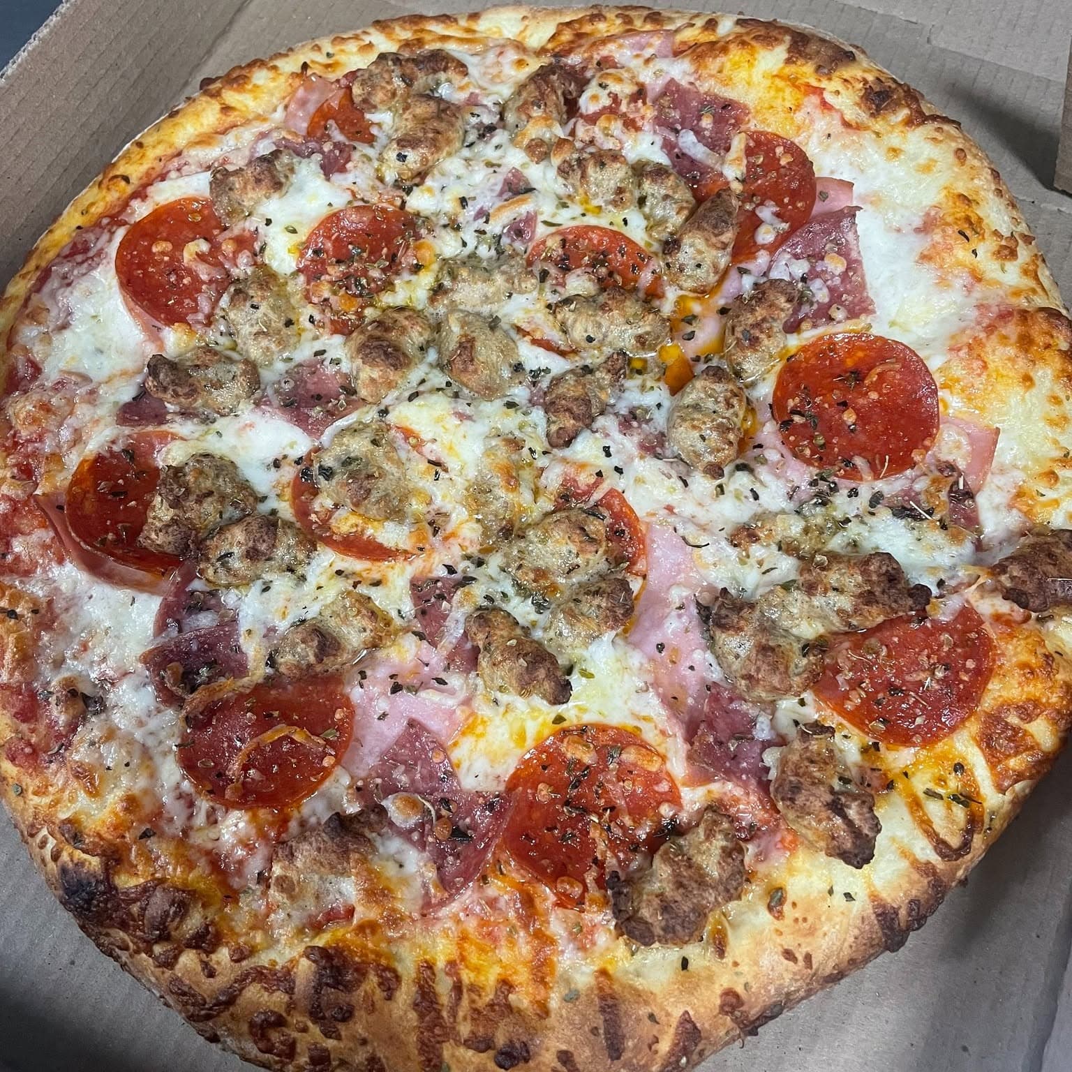 A loaded specialty pizza, fresh from the oven